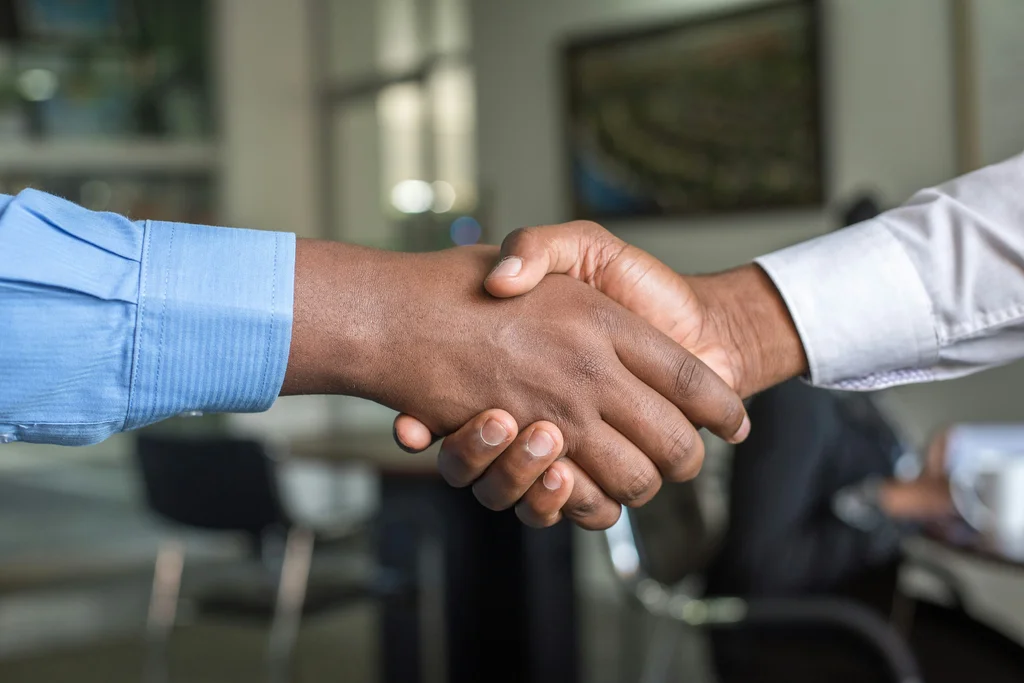 A handshake — the connection every vID is built to make easier